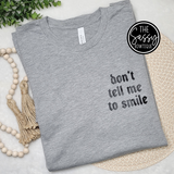 Don't Tell Me To Smile Pocket Tee